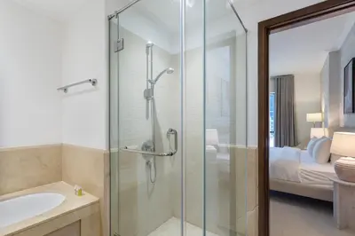 a bathroom with a shower and a sink at Exceptional 1-bedroom with pool view in Downtown in Dubai