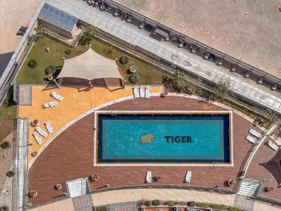 an overhead view of a swimming pool in a building at Frank Porter - Al Jawhara Tower in Dubai