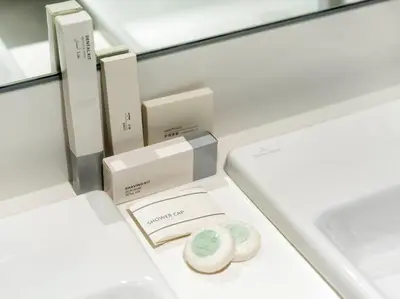 a white box with two donuts in it at Stunning Central 2BR Lagoon View & Private Beach in Dubai