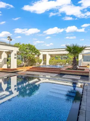 a swimming pool in front of a building at YOUR STAY CORPORATE RESIDENCES DIFC Sky Gardens in Dubai
