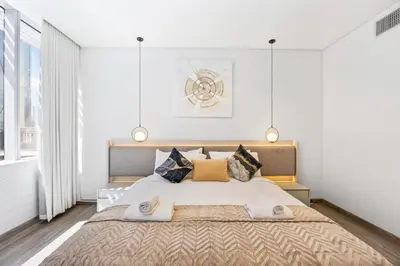 a bedroom with a large bed with pillows at YOUR STAY CORPORATE RESIDENCES DIFC Sky Gardens in Dubai