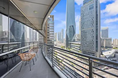 a balcony with chairs and a view of the city at YOUR STAY CORPORATE RESIDENCES DIFC Sky Gardens in Dubai