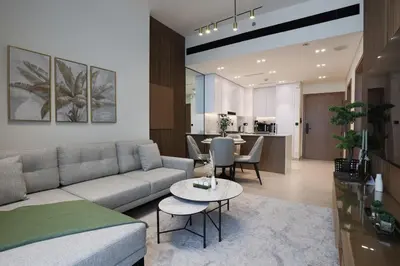a living room with a couch and a table at Gracious 1BR in Binghatti Amber in Dubai