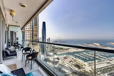 an apartment balcony with a view of the ocean at Ocean Heights Dubai Marina Ocean View in Dubai