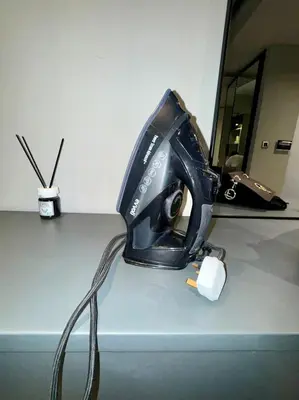 a hair dryer sitting on top of a desk at Burj Khalifa View 5 Mins Walk to Dubai Mall in Dubai