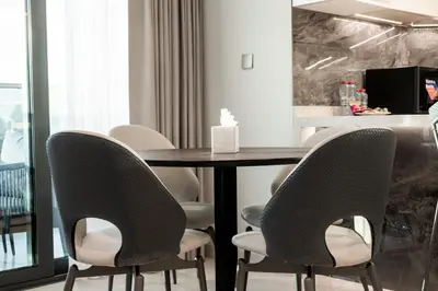 a dining room with a table and chairs at Luxurious Apt 2BR Stunning Full Burj Khalifa view in Dubai