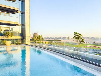 a swimming pool on the side of a building at Luxurious Apt 2BR Stunning Full Burj Khalifa view in Dubai