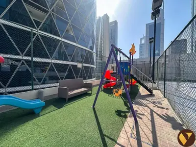 a playground on a balcony of a building at Vogue DIFC Damac Park Tower near Museum of The Future, One Bedroom Apartment with Balcony, City Skyline and Museum of The Future View, Access to all Amenities in Dubai