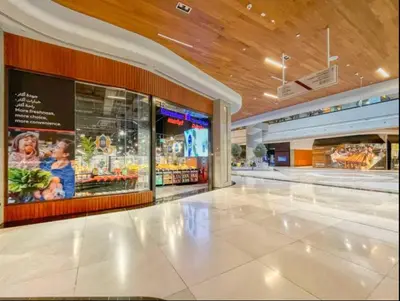 an empty shopping mall with a grocery store at Vogue DIFC Damac Park Tower near Museum of The Future, One Bedroom Apartment with Balcony, City Skyline and Museum of The Future View, Access to all Amenities in Dubai