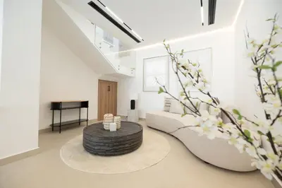 a living room with a couch and a table at Designer Furnished Villa with Luxury Finishes in Springs 14 in Dubai