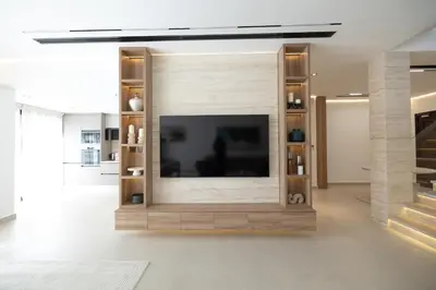 a living room with a flat screen tv on a wall at Designer Furnished Villa with Luxury Finishes in Springs 14 in Dubai