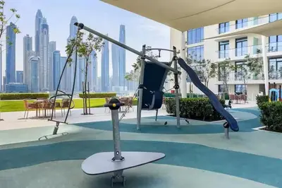 a playground in a building with a view of a city at Vogue Emaar Beach Front Marina Vista near JBR and Palm Jumeirah, Two Bedroom Apartment with Balcony and Private Beach, Access to all Amenities in Dubai