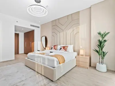 a bedroom with a large bed and a mirror at Modern Serenity Central Park 2BR Escape-51 in Dubai