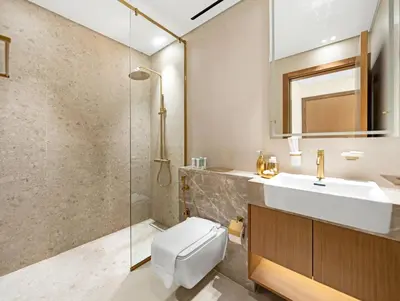 a bathroom with a toilet and a sink and a shower at Premium Burj Khalifa View & Private Jacuzzi in Dubai