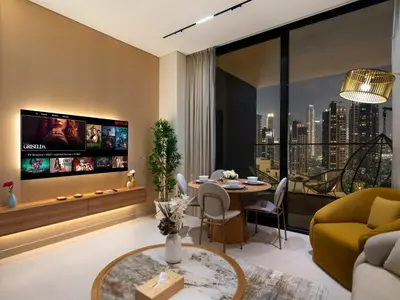 a living room with a tv and a couch and a table at Premium Burj Khalifa View & Private Jacuzzi in Dubai