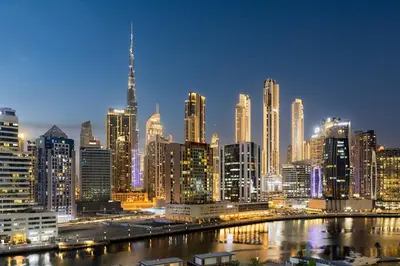 a view of a large city at night at Waves - Premium 1BR Apartment Overlooking Burj Khalifa in Dubai