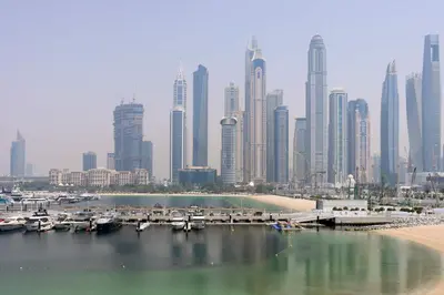 a view of a city with a marina and buildings at Livbnb - Chic 1BR, Beachfront & Marina Views in Dubai
