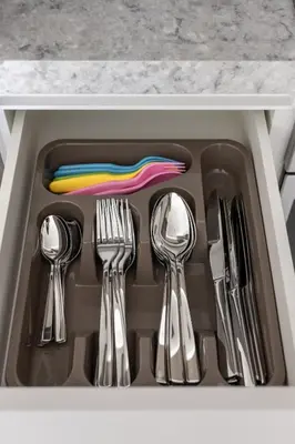 a drawer with utensils in a sink at Designer 2-BR - Sea View - Grand Bleu by Elie Saab in Dubai
