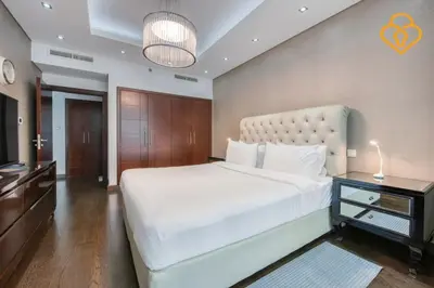 a bedroom with a large white bed and a television at Keysplease Upgraded 1 BR Apt near Dubai Mall, Burj Views in Dubai