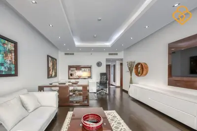 a living room with a white couch and a table at Keysplease Upgraded 1 BR Apt near Dubai Mall, Burj Views in Dubai
