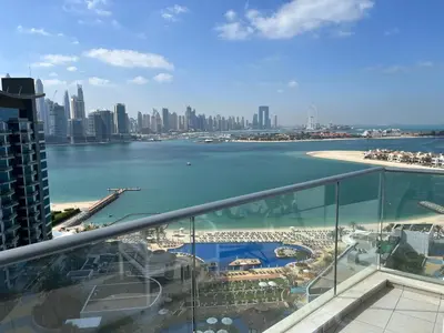 a view of the city from the balcony of a building at Oceana privat beach in Dubai