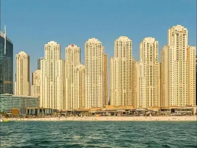 a skyline of a city with a beach and buildings at Diamond Marina Inn, Heart of Marina in Dubai