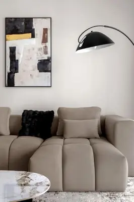 a living room with a couch and a lamp at Palm-View 2BR Elie Saab Luxury in Dubai