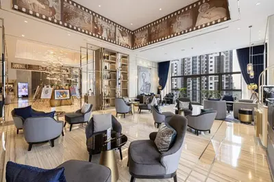 a salon with chairs and tables in a building at Sky-High Infinity Pool with Burj Khalifa Views in Dubai