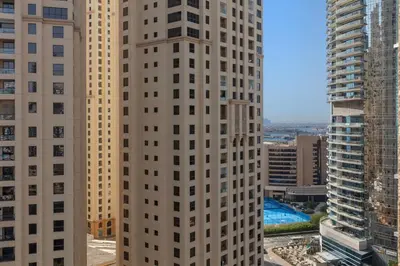 a view of two tall buildings in a city at Beautiful Marina Views 1 Bed in Dubai