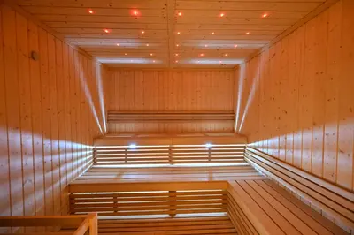 a sauna with a bench in the middle at Spacious 1 BHK with City Views Near Burj Khalifa in Dubai