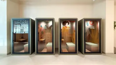 a group of four glass display cases on a wall at The Gifted Cozy Home in Dubai