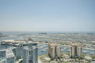 an aerial view of a marina with tall buildings at PVH - Palm Tower - Inviting Studio with Sea View in Dubai