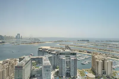 an aerial view of a city with buildings and a harbor at PVH - Palm Tower - Inviting Studio with Sea View in Dubai