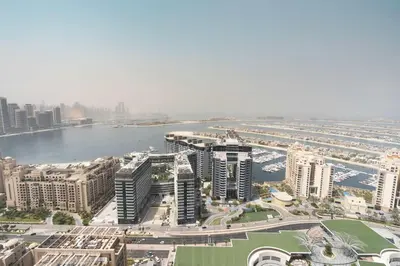 an aerial view of a city with a river and buildings at PVH - Palm Tower - Inviting Studio with Sea View in Dubai
