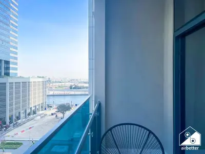 a balcony of a building with a view of the water at Luxury 2BR in Merano Tower Panoramic City Views in Dubai