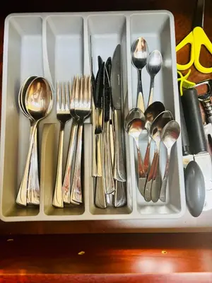 a tray filled with spoons and forks and spoons at Golden Hour Stay Sea View in Marina Dubai in Dubai