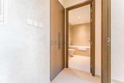 a bathroom with a toilet and a glass door at Apartment Steps from Burj Khalifa, Dubai Mall & Metro, Act One Act Two Tower 1, Downtown Dubai By Deluxe Holiday Homes in Dubai
