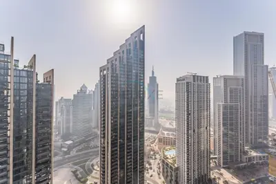 a view of a city with tall buildings at Apartment Steps from Burj Khalifa, Dubai Mall & Metro, Act One Act Two Tower 1, Downtown Dubai By Deluxe Holiday Homes in Dubai