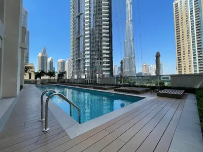 a swimming pool on the roof of a building at Apartment Steps from Burj Khalifa, Dubai Mall & Metro, Act One Act Two Tower 1, Downtown Dubai By Deluxe Holiday Homes in Dubai