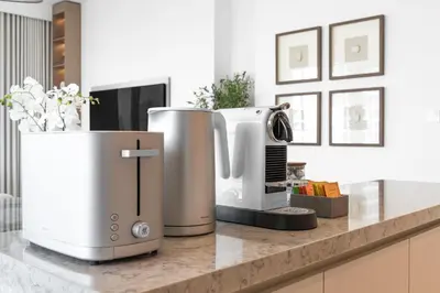 a kitchen with two appliances on a counter at Upscale 2-BR with Sea View - Grand Bleu by Elie Saab in Dubai