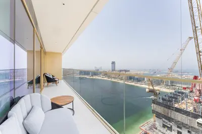 an apartment with a view of the water at Upscale 2-BR with Sea View - Grand Bleu by Elie Saab in Dubai