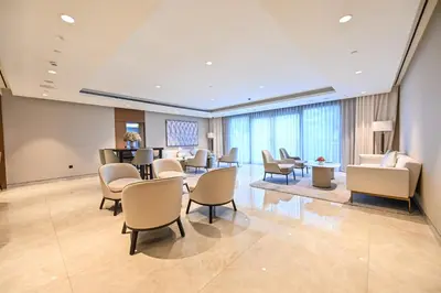 a waiting room at a hospital with chairs and a table at Majestic ActOne 1BR dowtown Dubai in Dubai