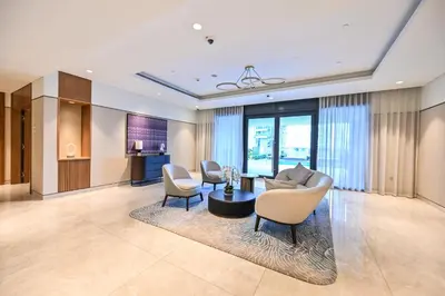 a living room with a table and chairs at Majestic ActOne 1BR dowtown Dubai in Dubai