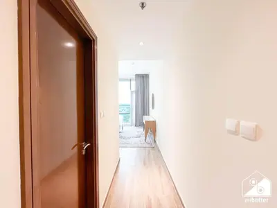 an open door to a room with a hallway at Stunning 2-Bedroom Apartment with Canal Views in Dubai