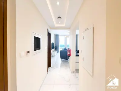 a corridor of a hotel room with a hallway at Wonderful 2B with Canal Views at Amna Tower in Dubai
