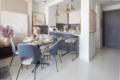 a dining room with a table and chairs at Frank Porter - Nobles Tower in Dubai