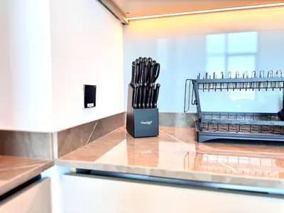 a knife block on a counter in a kitchen at 5 Star Apartment Dubai Burj KhalifaView in Dubai