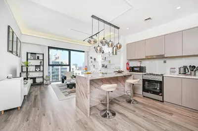 a kitchen with a large island in the middle at Comfy 2BR Act 1 Near Dubai Mall in Dubai