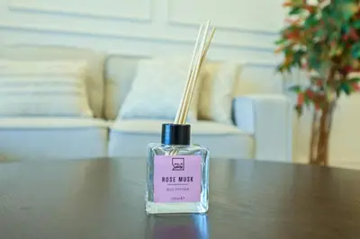 a bottle of first night perfume sitting on a table at Stylish 1BR in 8 Boulevard Walk in Dubai