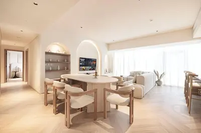 a kitchen and living room with a table and chairs at Seraya Residences at Marquise Square Tower in Dubai